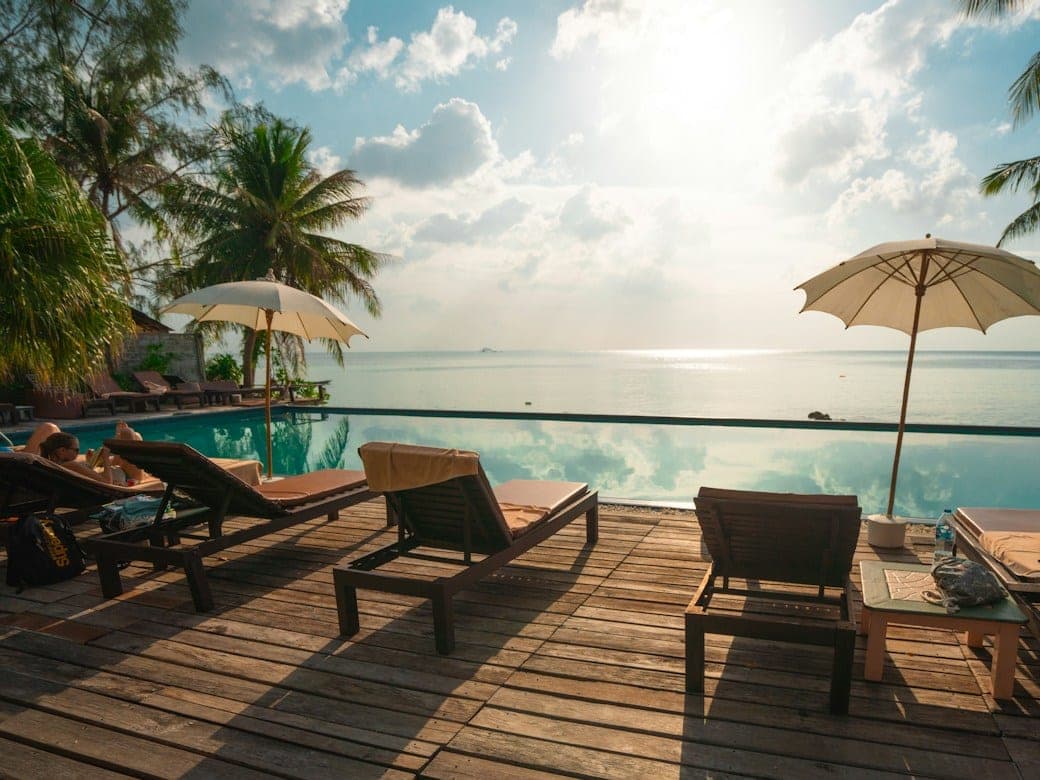A resort pool deck at sunset